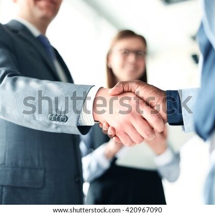 business-people-shaking-hands-finishing-600w-420967090[1]